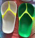 Papa Tee's white and green flip-flops with neon yellow straps. Comfortable, casual, slip-on sandals.