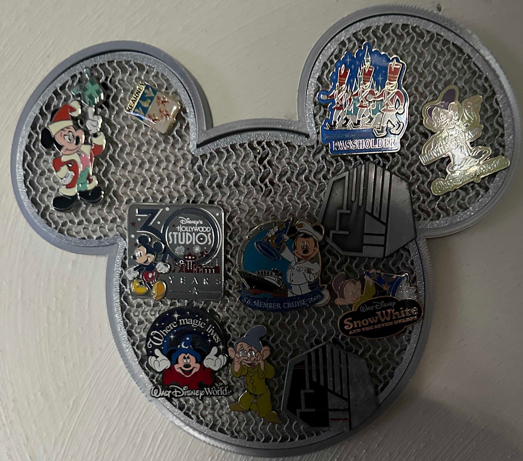 Papa Tee's silver Mickey Mouse shaped pin display holder with textured mesh interior. Holds Disney pins.