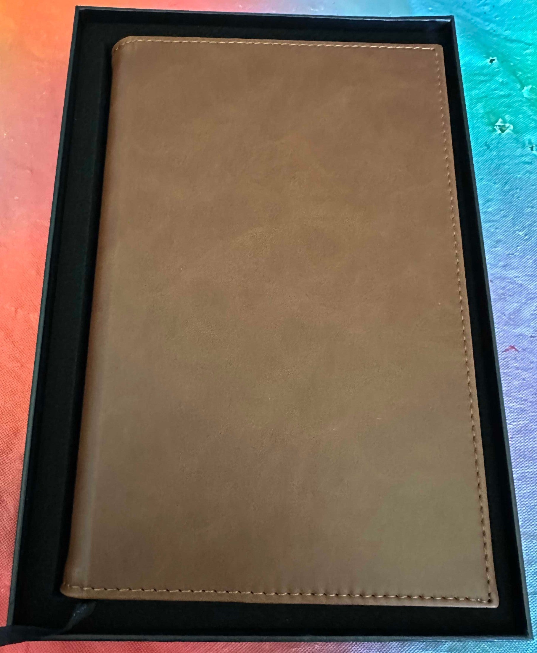 Papa Tee's classic tan faux leather journal notebook with stitched detailing, perfect for notes and planning.