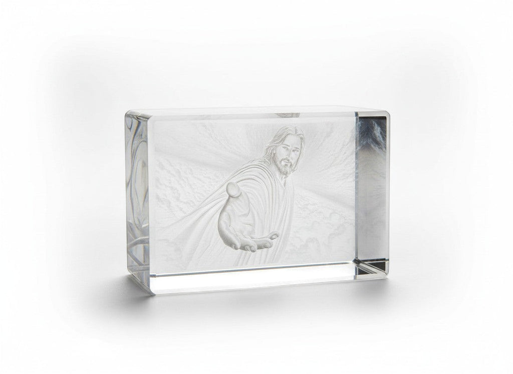 Papa Tee's crystal engraving of Jesus reaching out his hand, with a radiant background.