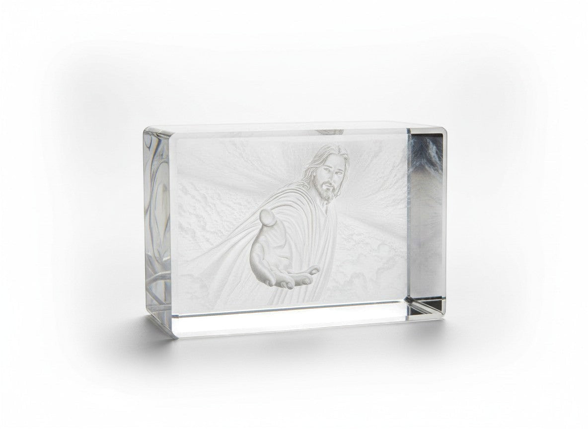Papa Tee's crystal engraving of Jesus reaching out his hand, with a radiant background.