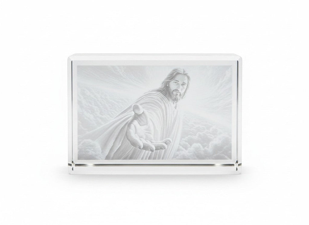 Papa Tee's glass block featuring a pencil drawing of Jesus reaching out his hand, set against a cloudy sky.