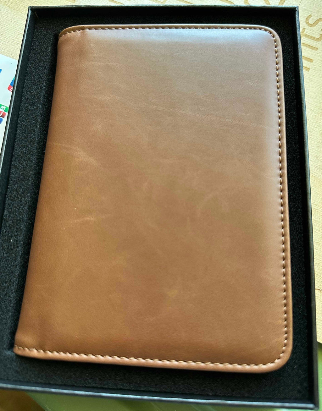 Papa Tee's warm brown genuine leather journal and notebook with stitched edges. Minimalist design, ideal for professionals.