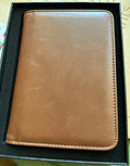 Papa Tee's warm brown genuine leather journal and notebook with stitched edges. Minimalist design, ideal for professionals.