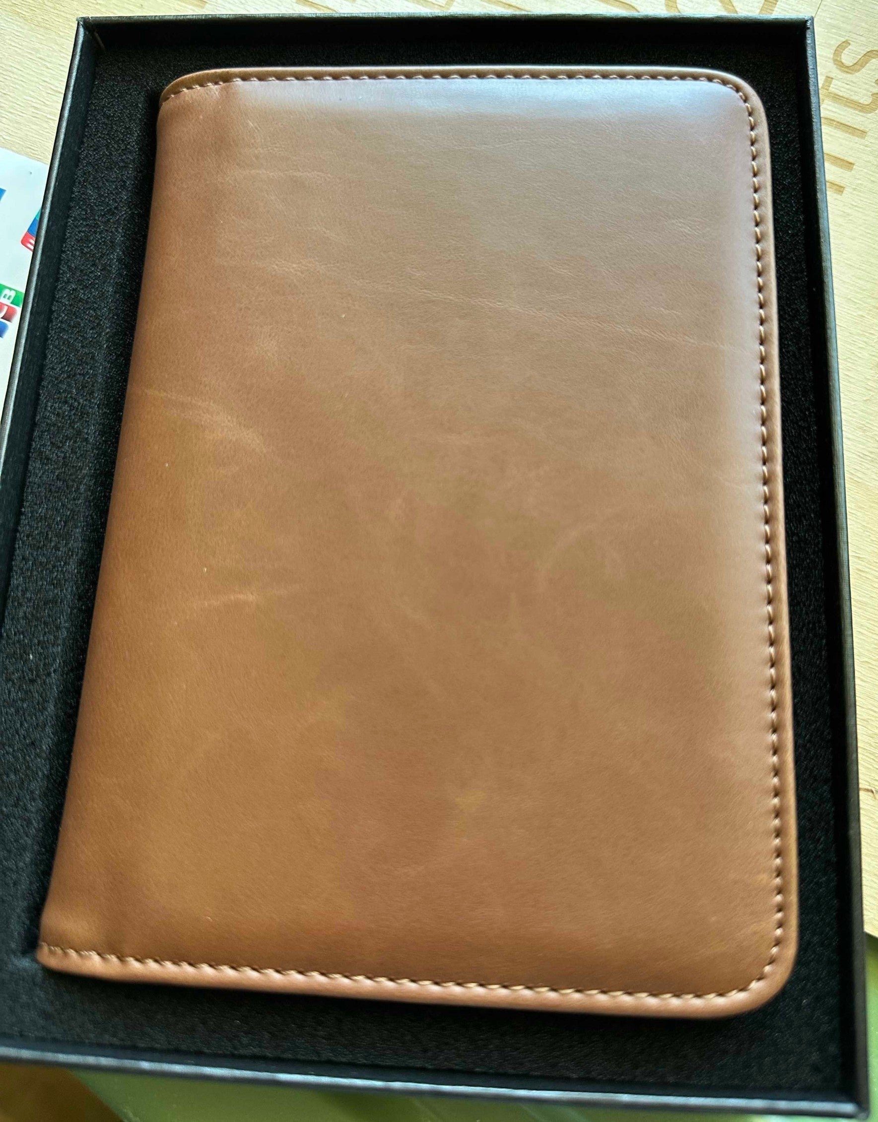 Papa Tee's warm brown genuine leather journal and notebook with stitched edges. Minimalist design, ideal for professionals.